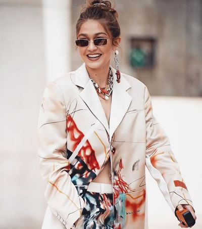 Gigi Hadid’s Jewellery Style Is More Affordable Than You Think 3 Gigi Hadid's jewellery style pairs a dangling toy car earring with a pearl drop.